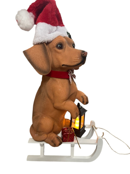 Grosse Dackelfigur auf Schlitten